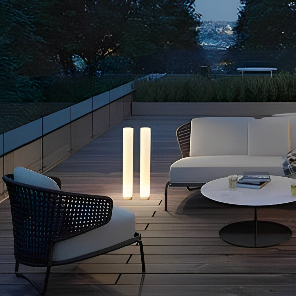 Glowing pillar light enhancing a stylish outdoor terrace with ambient light.