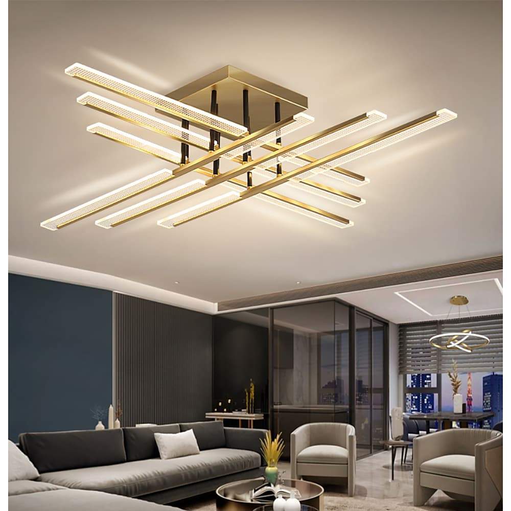 Gold cross ceiling light installed in an open-plan living area with contemporary decor.
