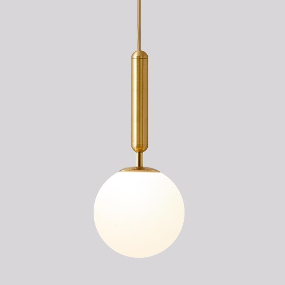 Elegant gold hanging lights with a brass stem and glowing white frosted glass globe shade.