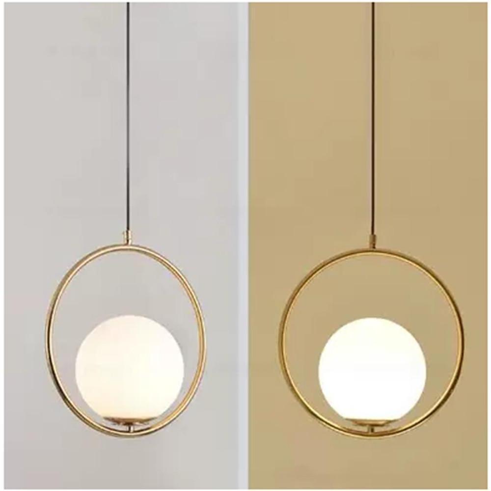 Elegant minimalist hanging lamp detail with gold ring shown in warm and cool lighting tones.