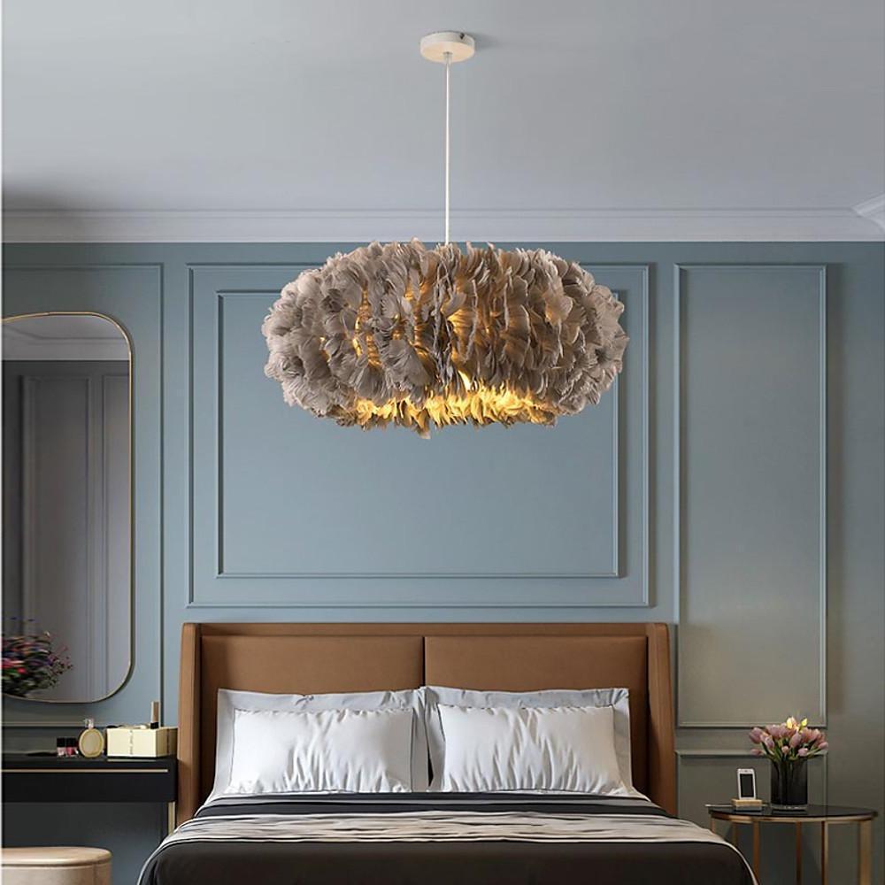 Contemporary bedroom design using a gray fluffy hanging light for subtle and elegant lighting.