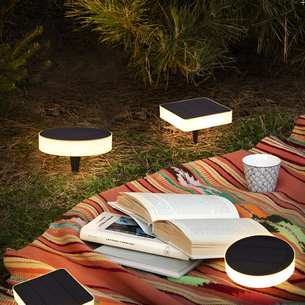 Ground solar lights enhancing a modern poolside area with warm light.