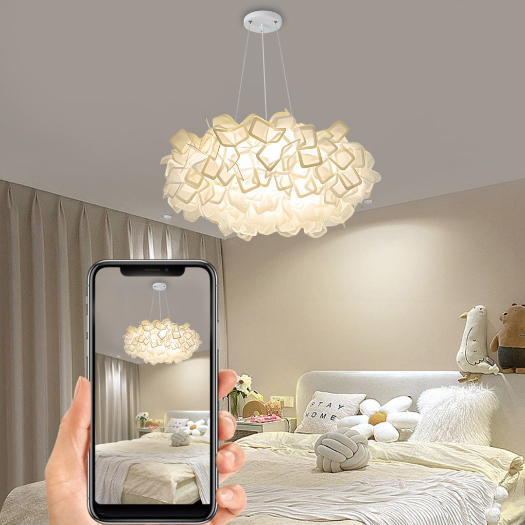 Hanging petal light fixture in a bedroom with green curtains, creating a serene atmosphere.