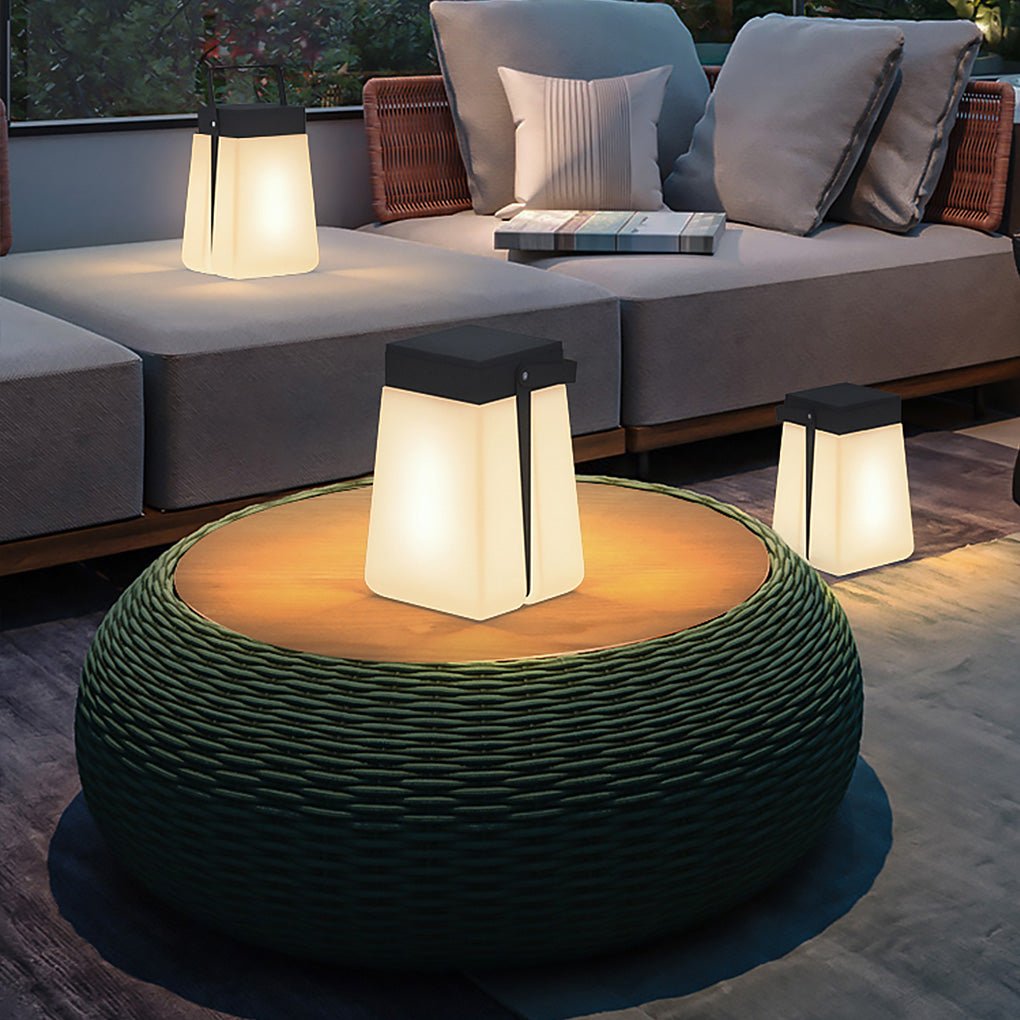 Hanging solar lantern lights displayed on a patio table, adding warm decorative lighting to a contemporary seating space.