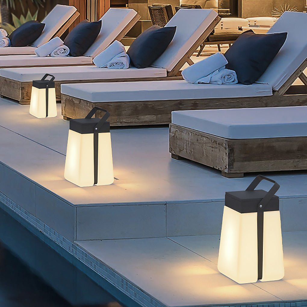 Hanging solar lantern lights arranged beside poolside loungers, enhancing resort-style outdoor lighting at dusk.