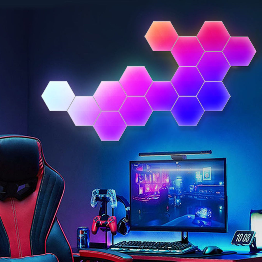 Hexagon LED wall lights installed above a gaming desk, creating dynamic background lighting for a modern setup.