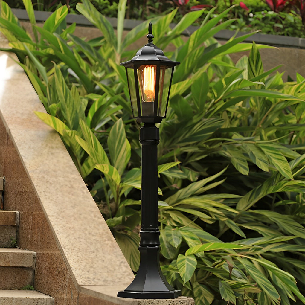 Hexagon path light enhancing a modern outdoor seating area with warm light.