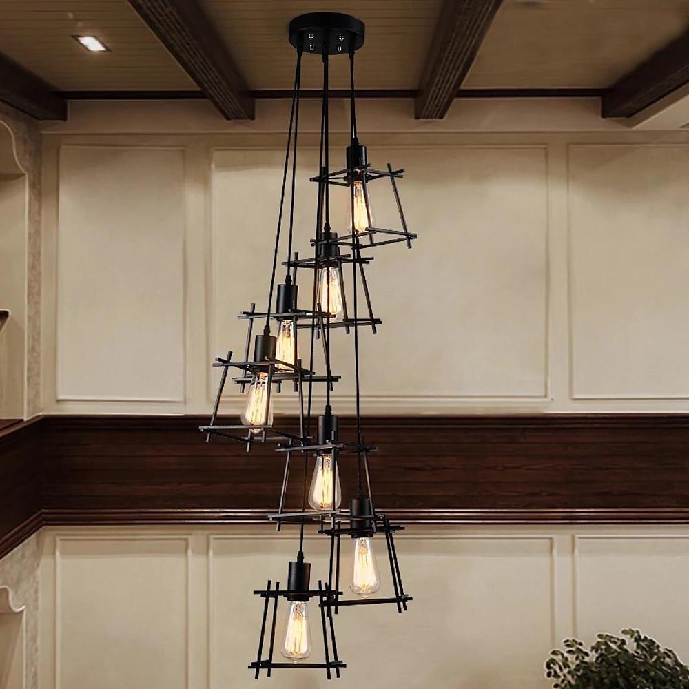 High ceiling interior styled with a vertical cluster cage pendant light creating dramatic lighting.