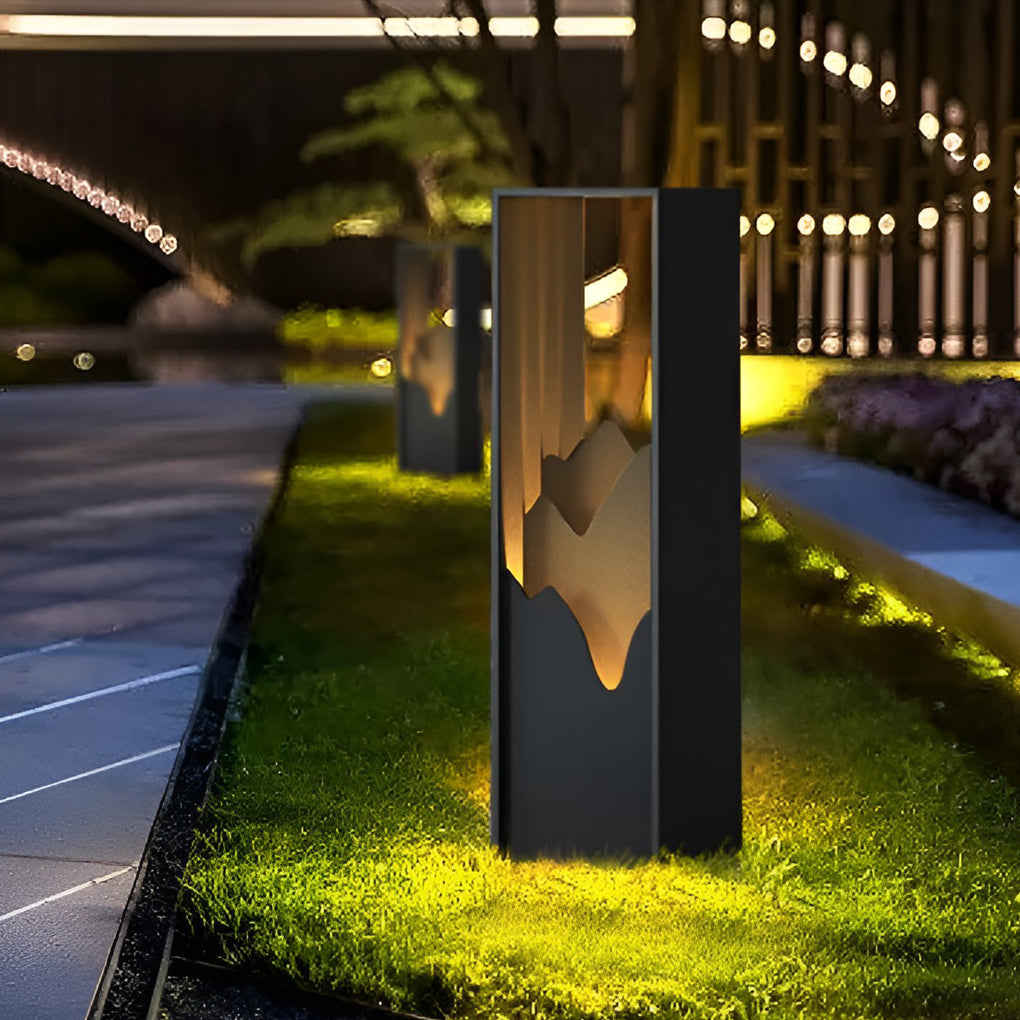 Hollow lawn lamp enhancing a contemporary outdoor space with warm illumination.