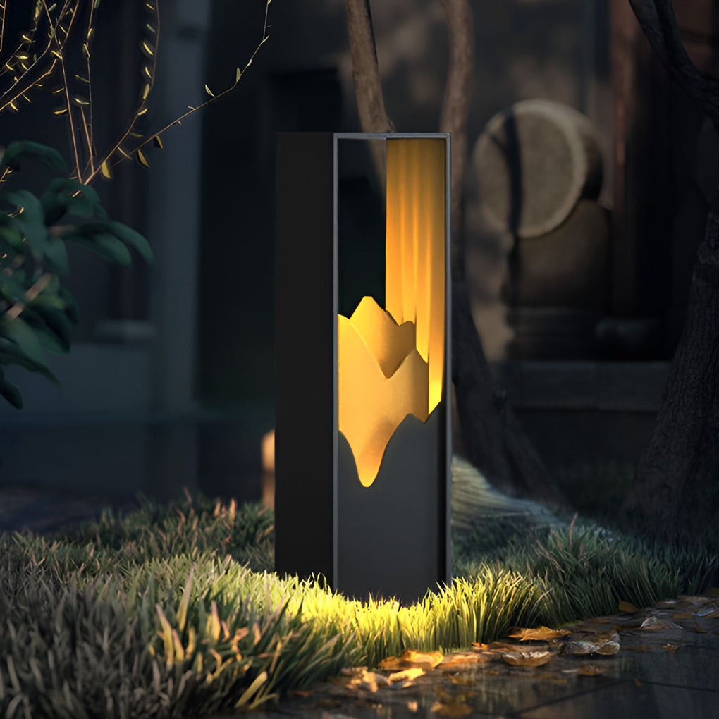 Hollow lawn lamp illuminating a modern driveway with elegant light.