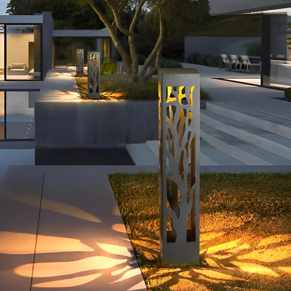 Hollow outdoor landscape lighting casting artistic shadows on modern courtyard pavement.