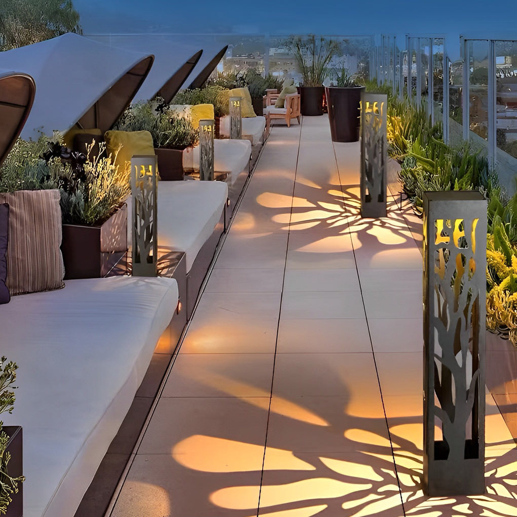 Hollow outdoor landscape lighting arranged along terrace walkway with repeated shadow patterns.