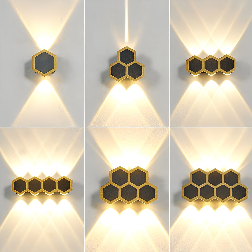 Honeycomb LED lights wall with detailed view of its gold and black finish.