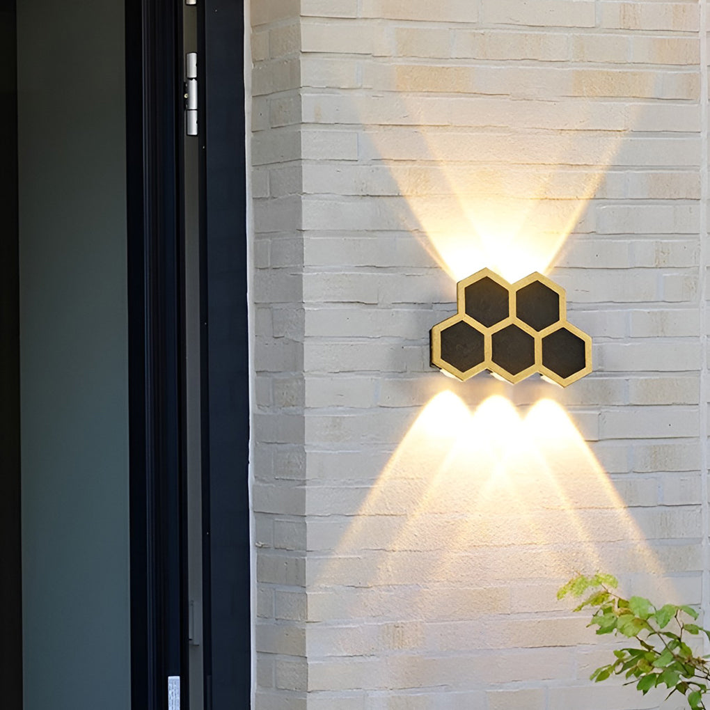 Honeycomb LED lights wall enhancing a modern outdoor living space with warm light.