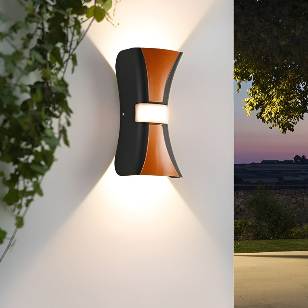 Hourglass wall light enhancing a modern outdoor staircase with warm light.