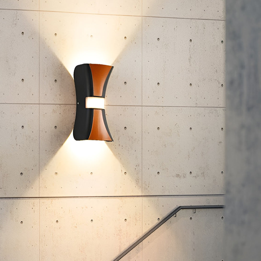 Hourglass wall light enhancing a stylish outdoor entrance with ambient light.