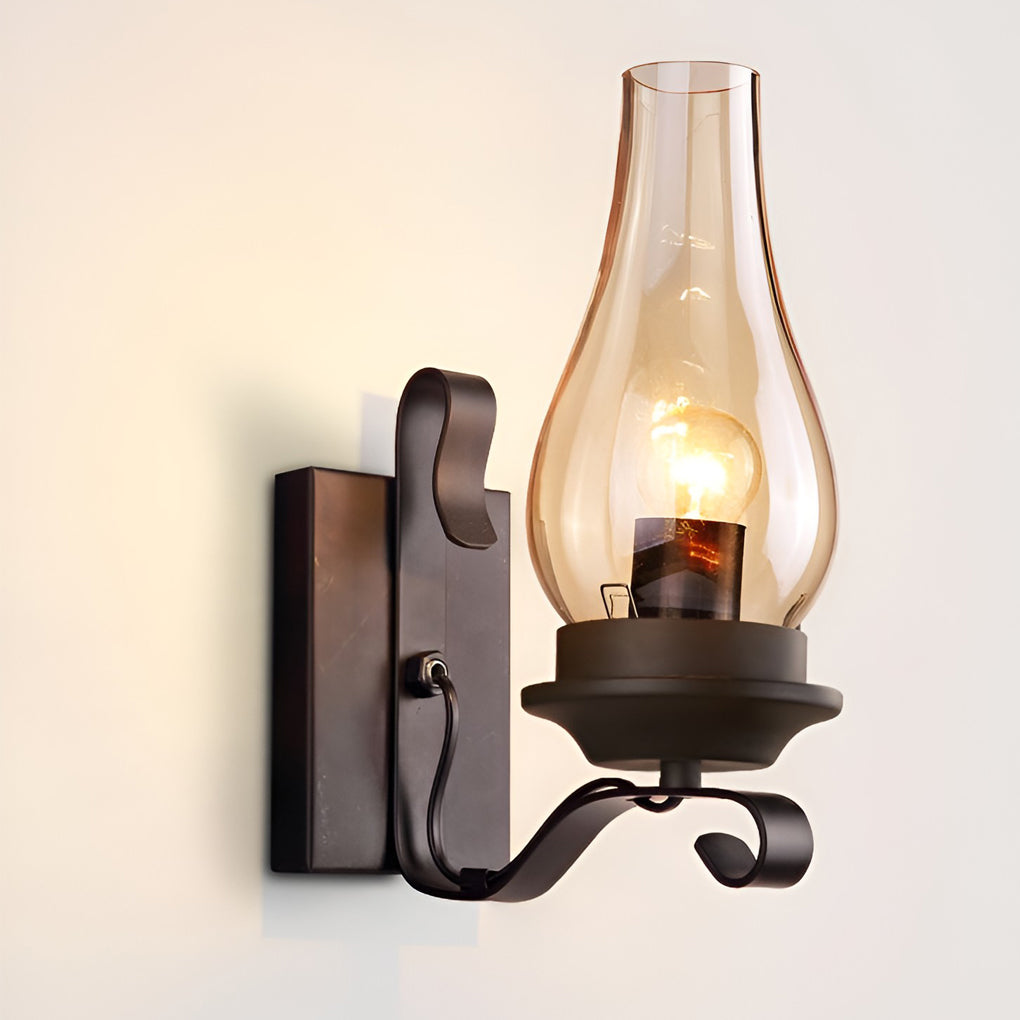 Hurricane wall light with detailed view of its wrought iron arm.