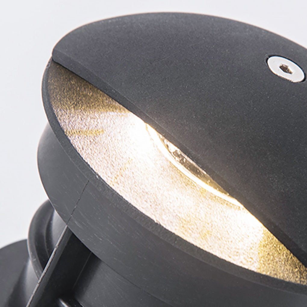 Top view of in-ground low voltage landscape lighting fixture, showcasing its durable and sleek black design.