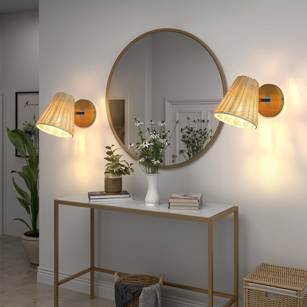 Stylish Japanese wall light in rattan, casting a gentle glow near a round mirror and console table with decor.