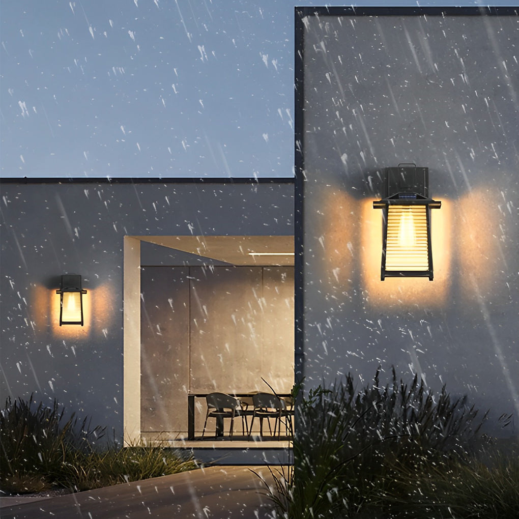 Lantern outdoor wall light in black finish, adding elegance to a minimalist outdoor living space.