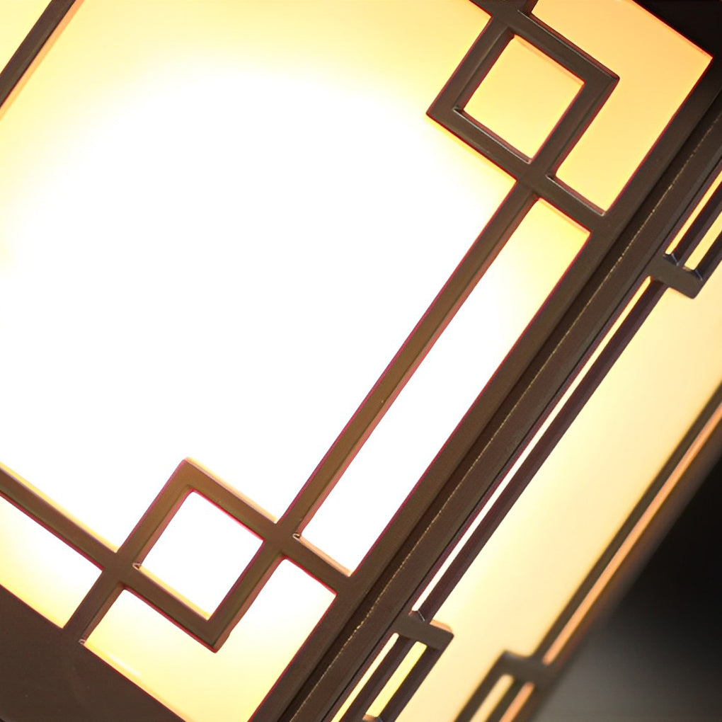 Lantern pillar lights close-up highlighting geometric frame pattern and warm light diffuser.