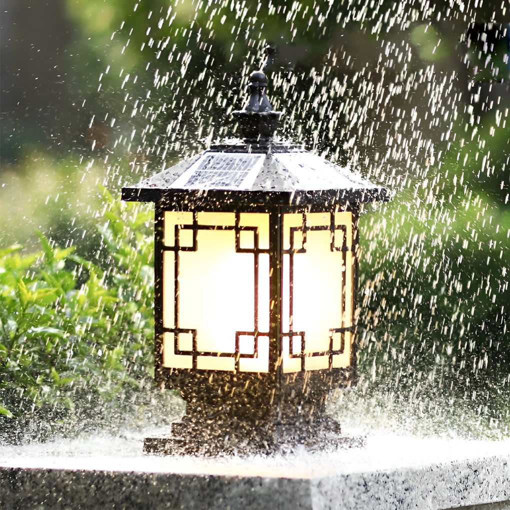 Lantern pillar lights shown under heavy water spray demonstrating outdoor waterproof performance.