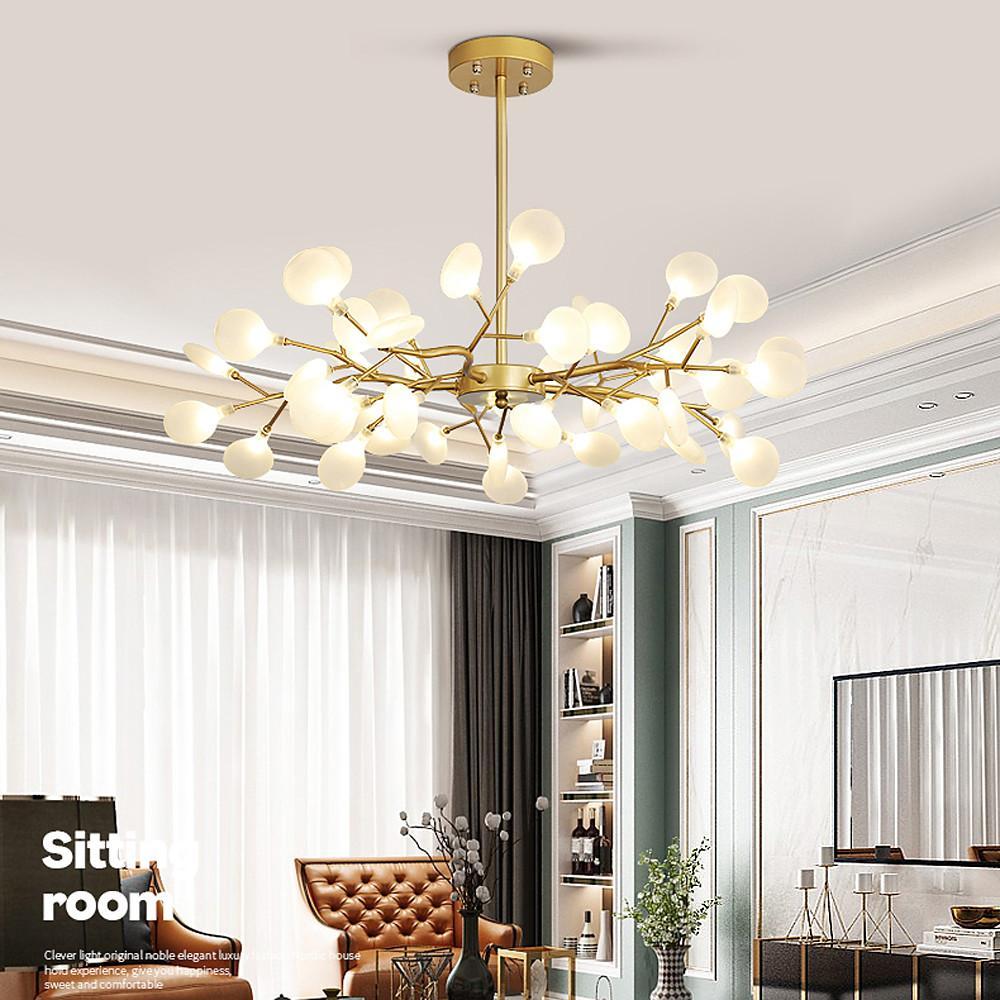 Large firefly pendant light in bright living room with curtains.