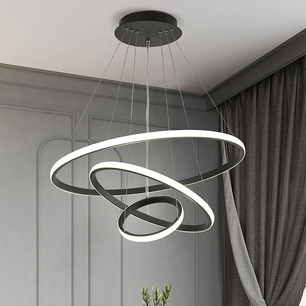 Modern ring LED chandelier with layered hanging rings.
