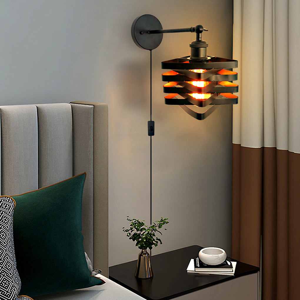 Stylish wall mount lights with plug, showcasing a layered wooden shade, mounted beside a green pillow on a bed.