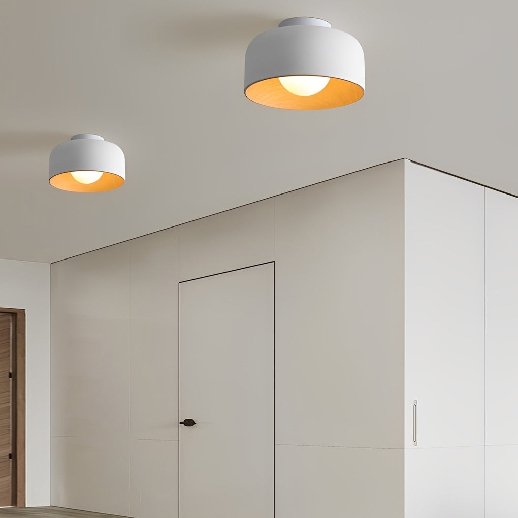 LED ceiling light with wood grain finish, illuminating a minimalist hallway with soft light.