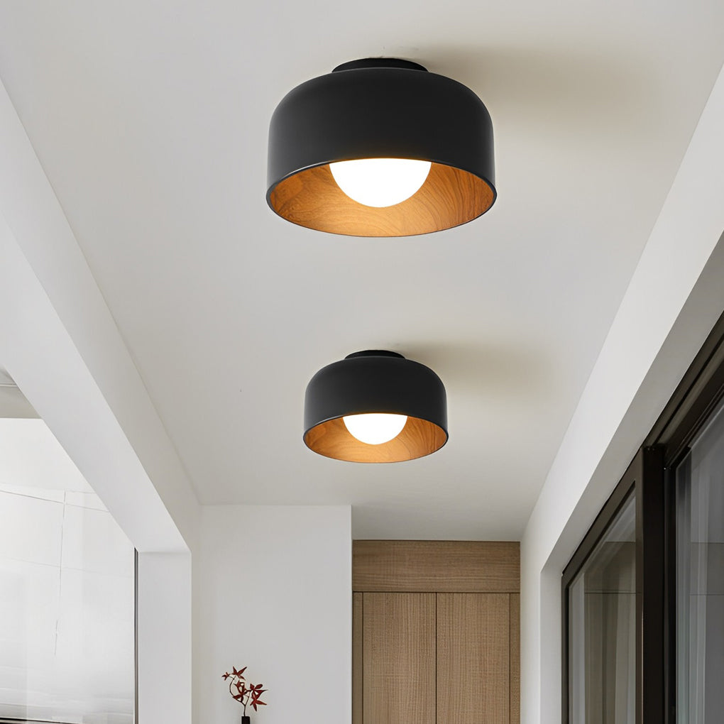 LED ceiling light with wood grain design, installed in a modern hallway for elegant illumination.