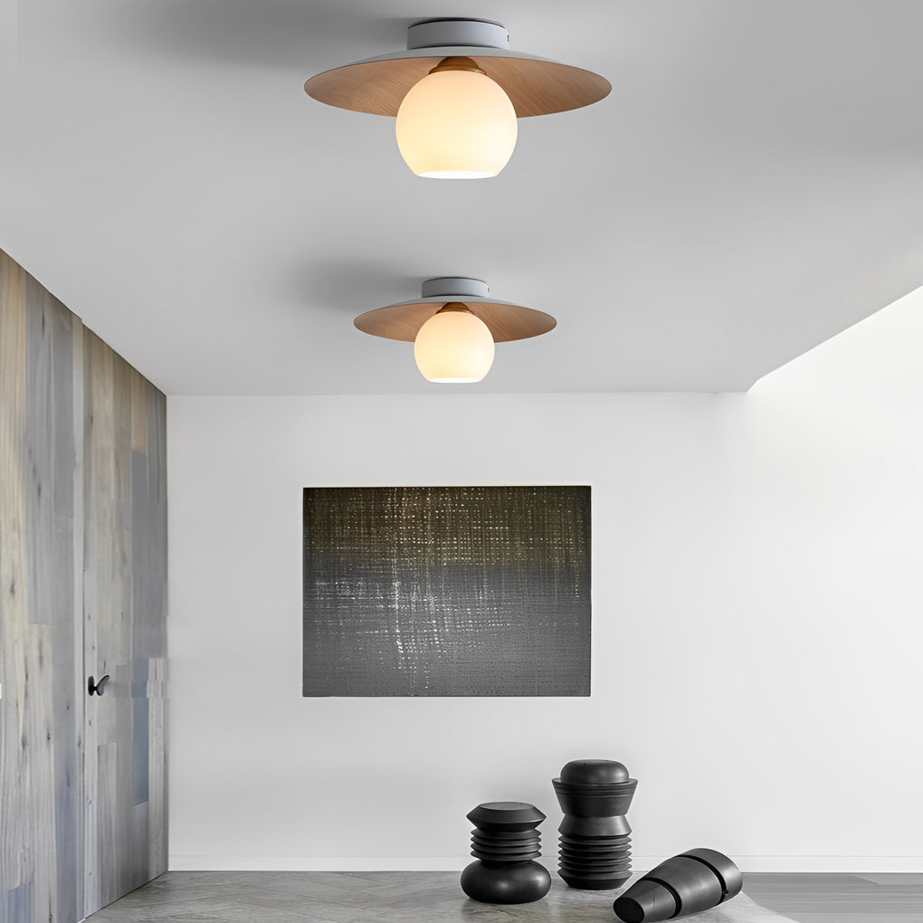 LED ceiling light with wood grain interior, providing warm illumination in a modern living room.