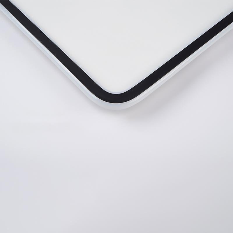 Close-up detail of square LED ceiling light with rounded corners