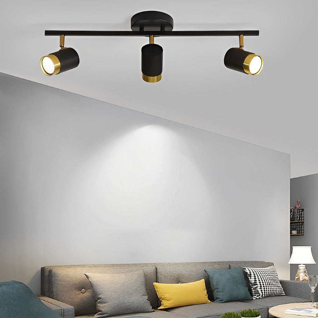LED ceiling track spotlights with adjustable heads, installed in a modern living room.