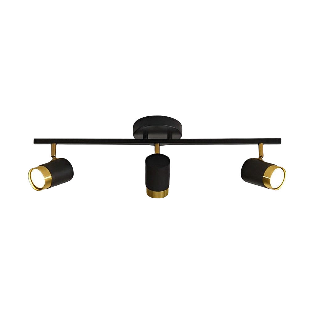 LED ceiling track spotlights with a gold accent, providing focused lighting in a stylish bedroom.