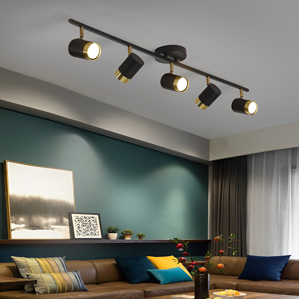 LED ceiling track spotlights with a sleek design, installed in a minimalist dining room.