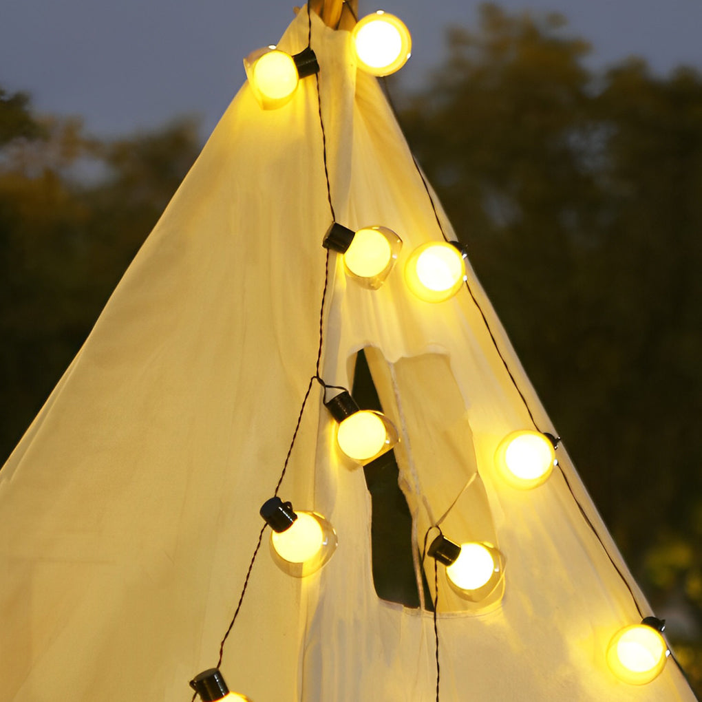 LED globe string lights arranged inside a tent-style canopy, casting a warm glow for outdoor gatherings and events.