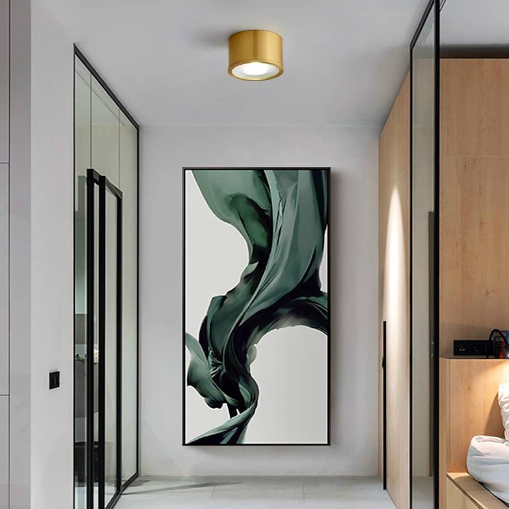 LED surface mounted downlights used in a contemporary corridor space.