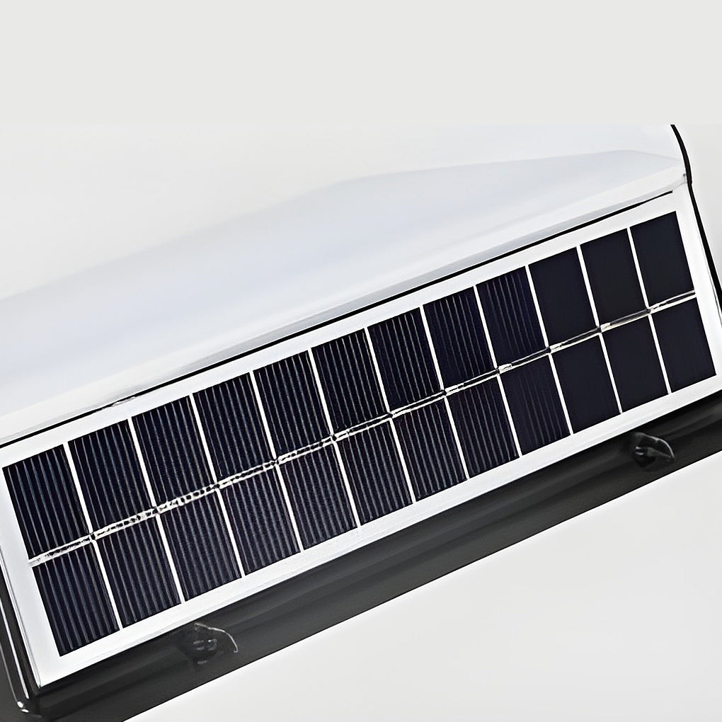 LED wall solar light with solar panel on top, casting bright light indoors.