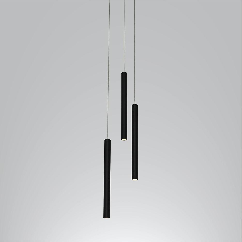 Linear cluster pendant light with mixed-height black tube pendants creating a layered lighting effect.
