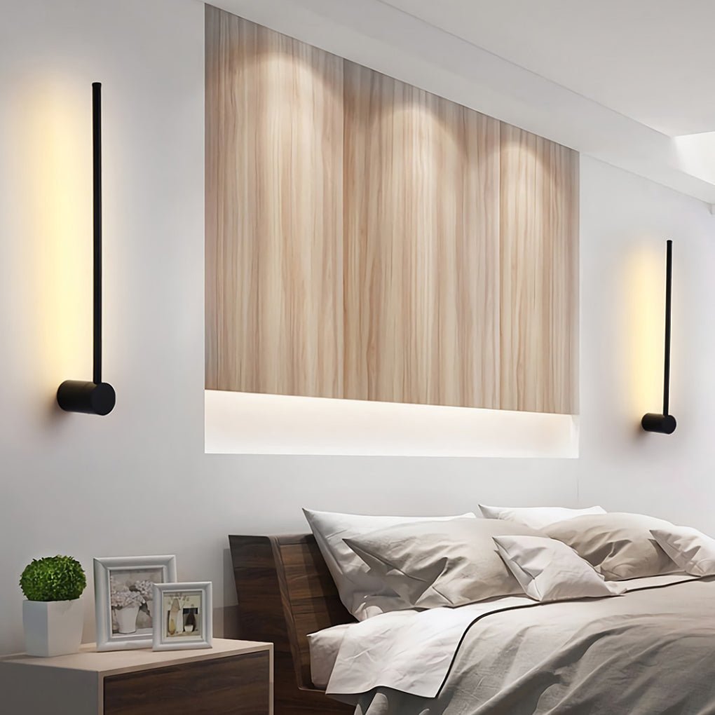 Linear LED wall lights above bedroom headboard