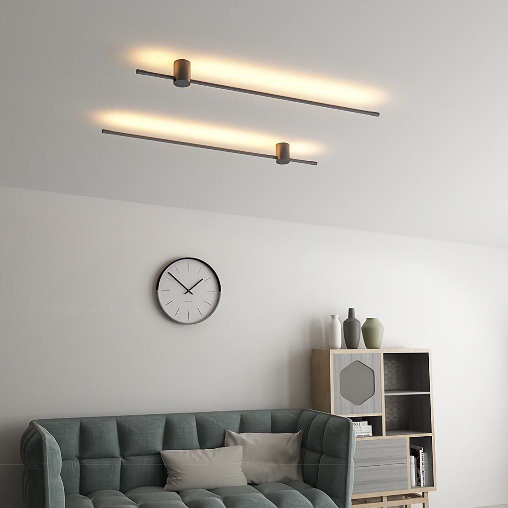 Linear LED light mounted near ceiling in modern space