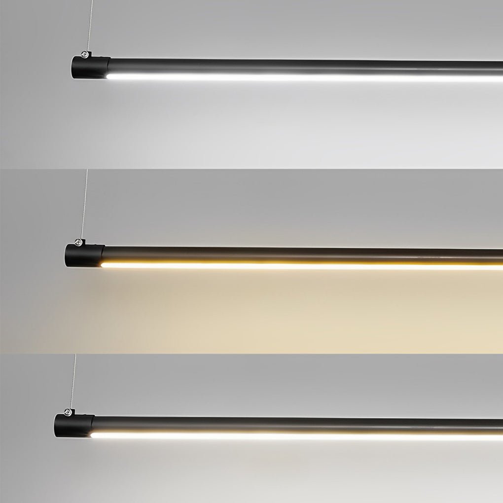 Linear pendant light fixture installed above wooden desk for workspace lighting.