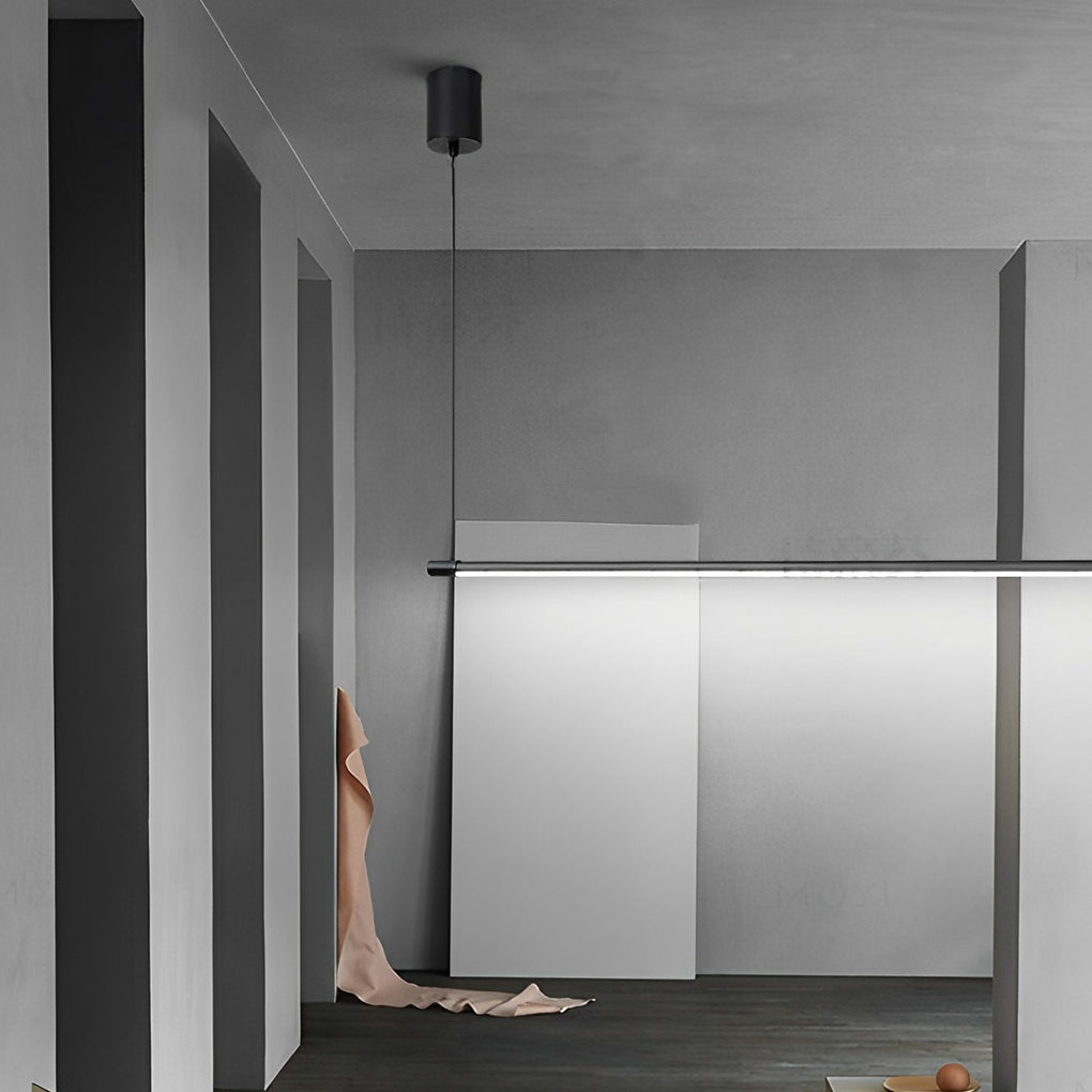 Linear pendant light fixture used as task lighting above modern kitchen counter.