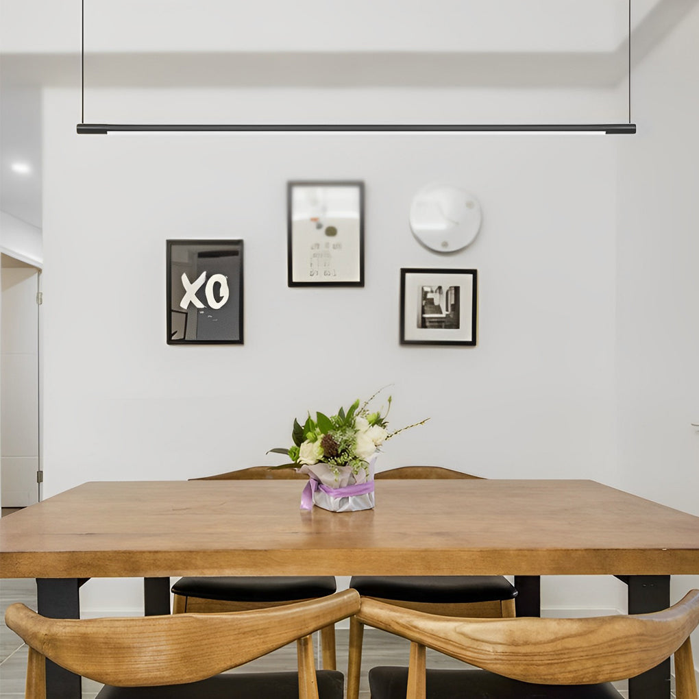 Modern linear pendant light fixture installed above kitchen island.