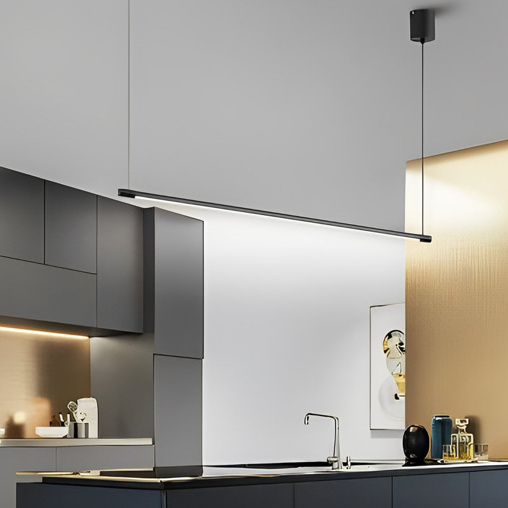 Linear pendant light fixture above dining table with clean white interior background.