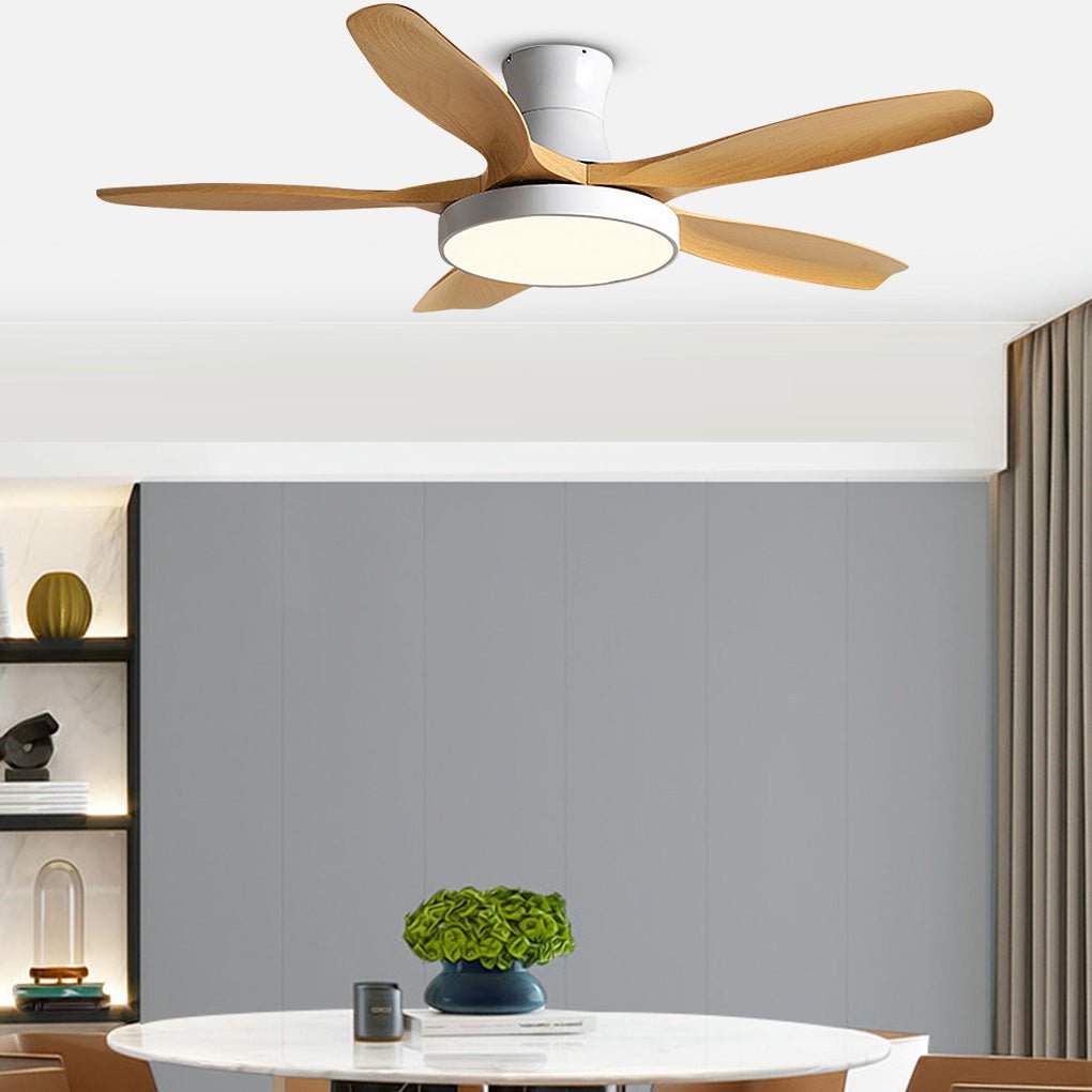 Modern living room ceiling fan with lights mounted above a dining-living area, providing soft illumination and natural airflow.