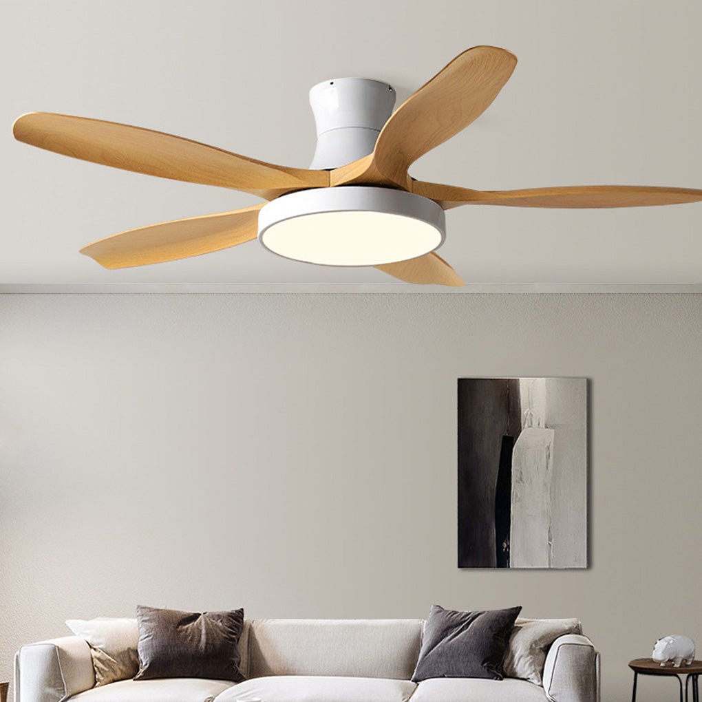 Living room ceiling fan with lights above a minimalist sofa setting, designed with a white motor and warm wood blades.