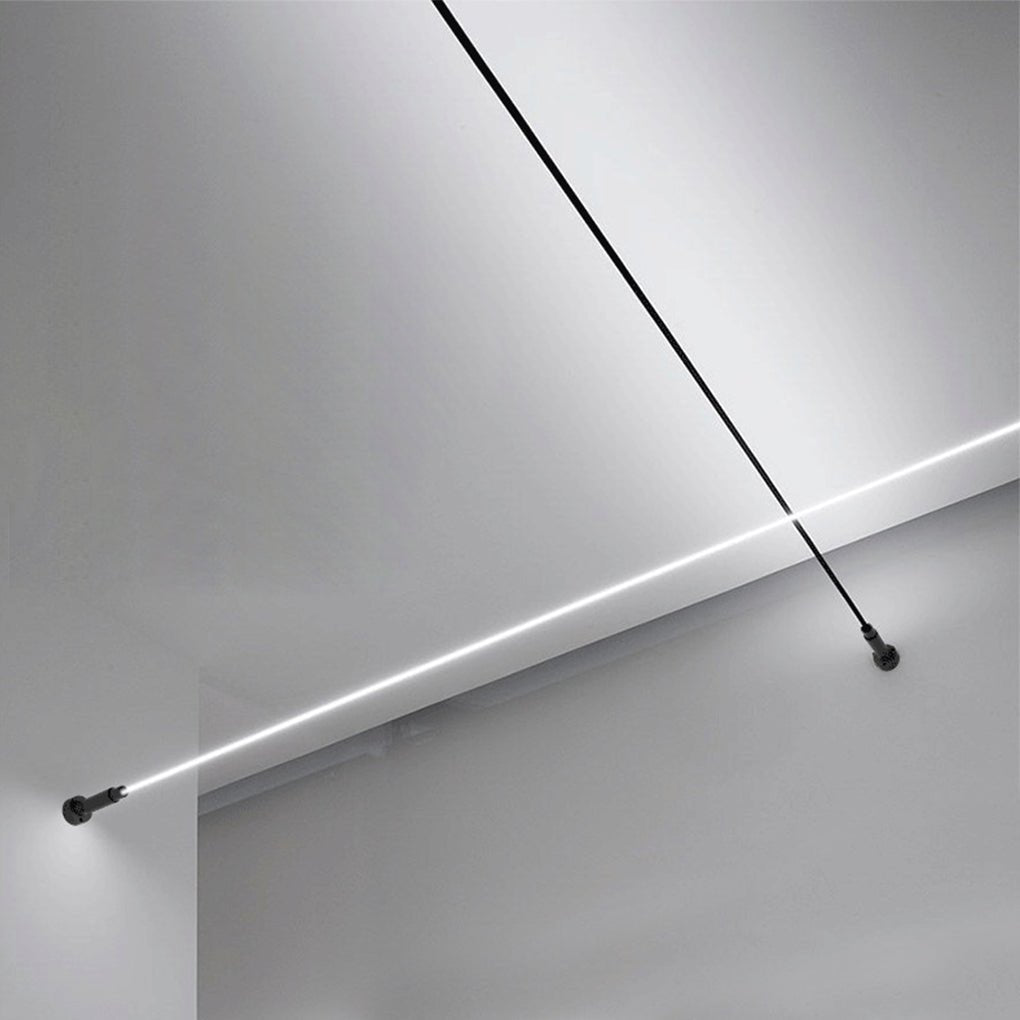 Close up of long led lights strips for room mounted diagonally across a plain white ceiling