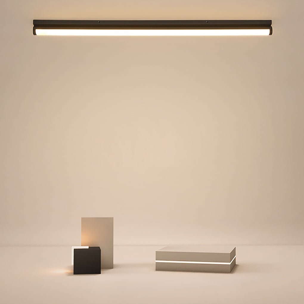 Long strip ceiling light illuminating a cozy living room with warm light.